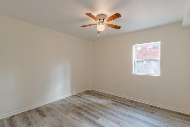 unfurnished room with ceiling fan and light wood-type flooring