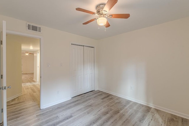 unfurnished bedroom with a closet, ceiling fan, and light hardwood / wood-style flooring