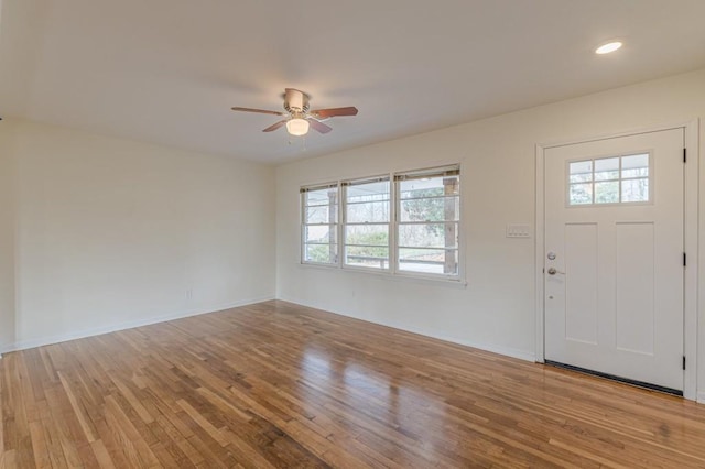 entrance foyer with ceiling fan and light hardwood / wood-style flooring