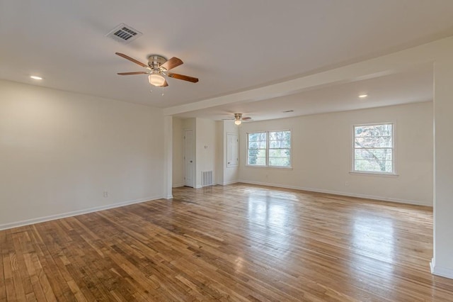 unfurnished room with ceiling fan and light hardwood / wood-style flooring