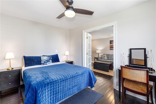 bedroom with ceiling fan and dark wood-type flooring