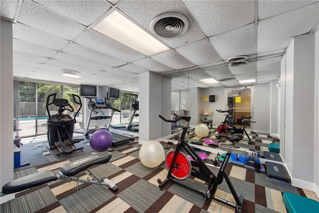 gym featuring a drop ceiling