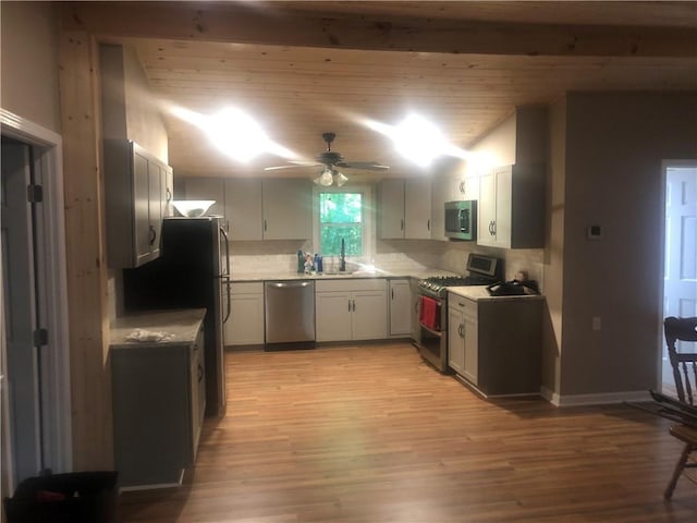 4744 Chickasaw Way SE, Acworth, GA 30102 - kitchen with appliances with stainless steel finishes, ceiling fan, decorative backsplash, and light wood-style flooring