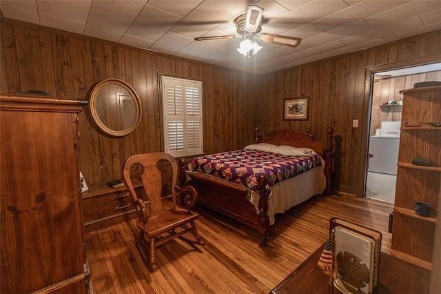 166 Etowah Dr, Cartersville, GA 30120 - bedroom with wood walls, washer / clothes dryer, ceiling fan, and wood finished floors