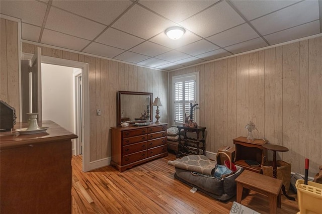 166 Etowah Dr, Cartersville, GA 30120 - bedroom with wood walls, a paneled ceiling, and hardwood / wood-style floors