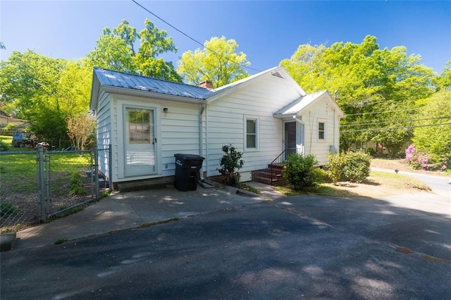 166 Etowah Dr, Cartersville, GA 30120 - rear view of house featuring metal roof and fence