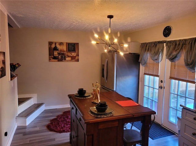 1625 Conley Rd Unit 229, Conley, GA 30288 - home office featuring a chandelier, a textured ceiling, dark wood-style floors, and french doors