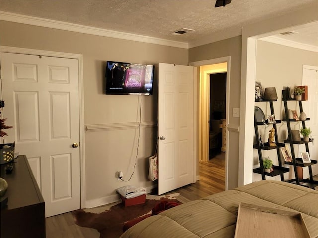 1625 Conley Rd Unit 229, Conley, GA 30288 - bedroom with wood finished floors, crown molding, and a textured ceiling