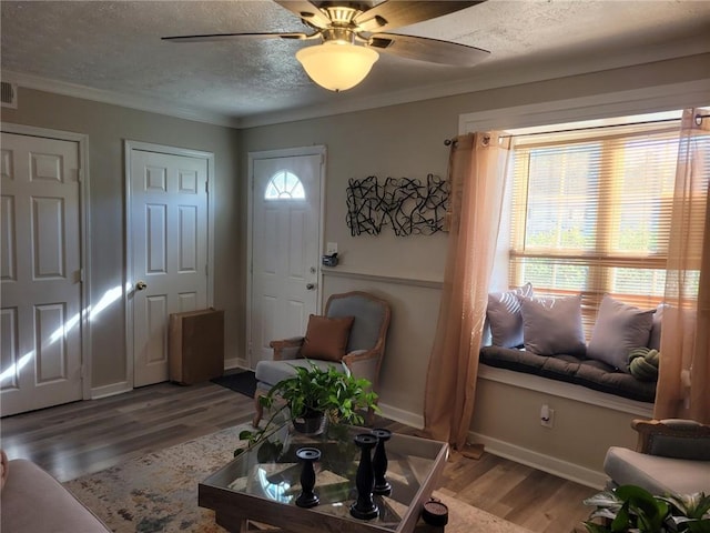 1625 Conley Rd Unit 229, Conley, GA 30288 - living area with wood finished floors, ceiling fan, a textured ceiling, and crown molding