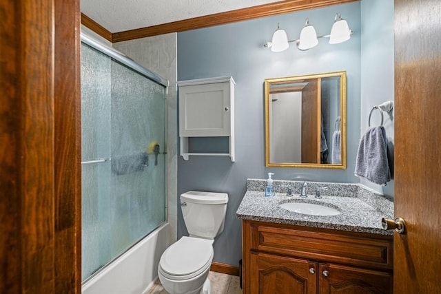 full bathroom with toilet, bath / shower combo with glass door, ornamental molding, and vanity