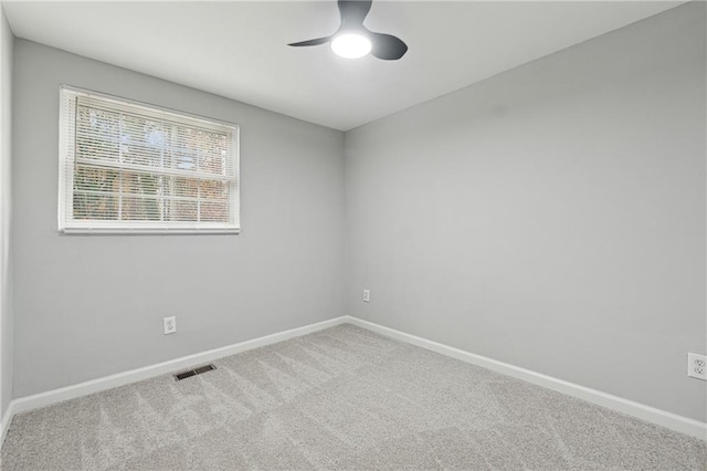 carpeted empty room with ceiling fan