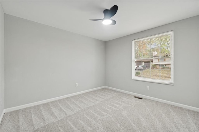 unfurnished room with carpet and ceiling fan