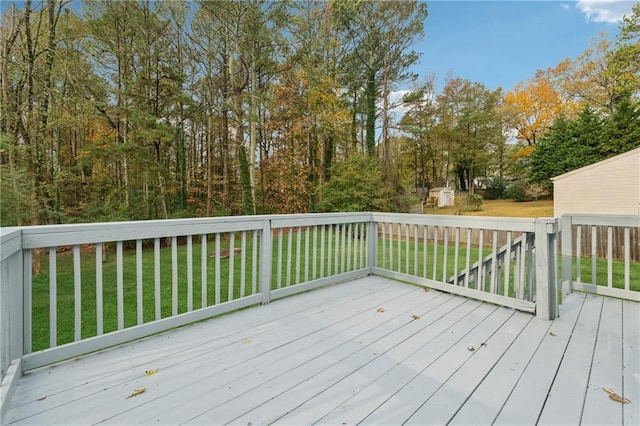 wooden deck with a yard