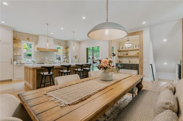 dining area with recessed lighting and light wood-type flooring