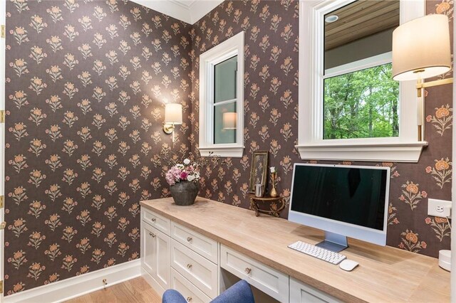 bathroom with baseboards and wood finished floors
