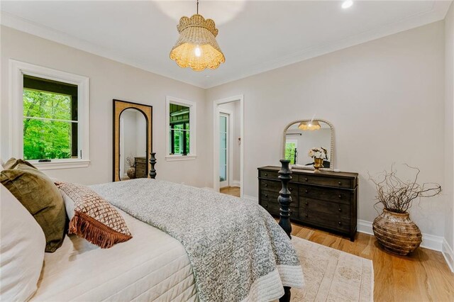bedroom featuring baseboards, multiple windows, recessed lighting, and light wood-style flooring