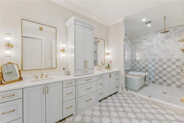 full bathroom featuring a sink, a stall shower, double vanity, and visible vents