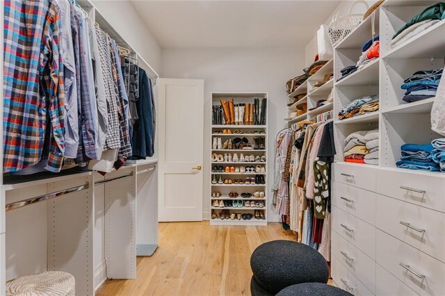 walk in closet featuring light wood-style flooring