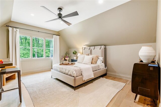 bedroom featuring recessed lighting, baseboards, vaulted ceiling, and light wood-style floors