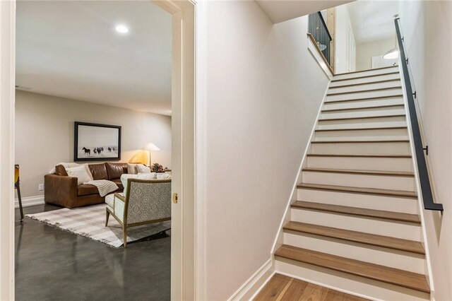 staircase featuring baseboards