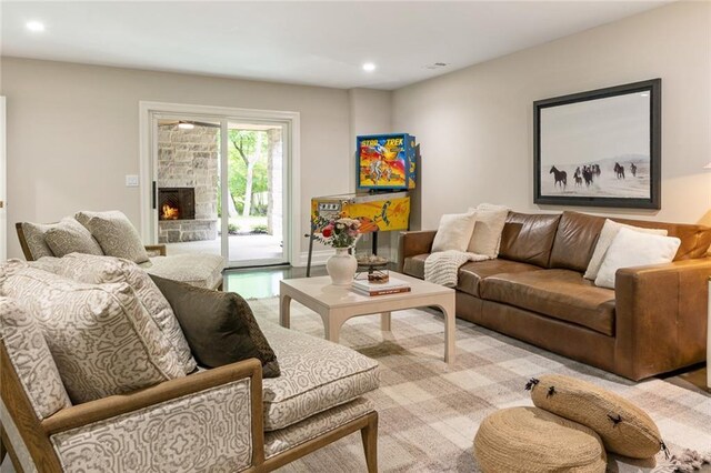 living area featuring a fireplace and recessed lighting
