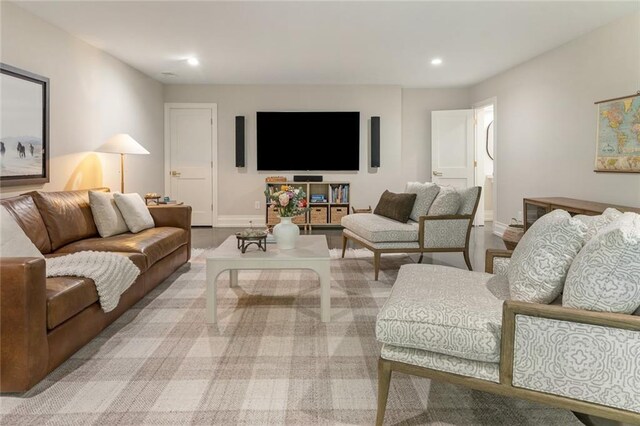 living area with recessed lighting and baseboards