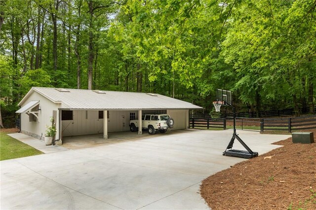 view of basketball court with fence
