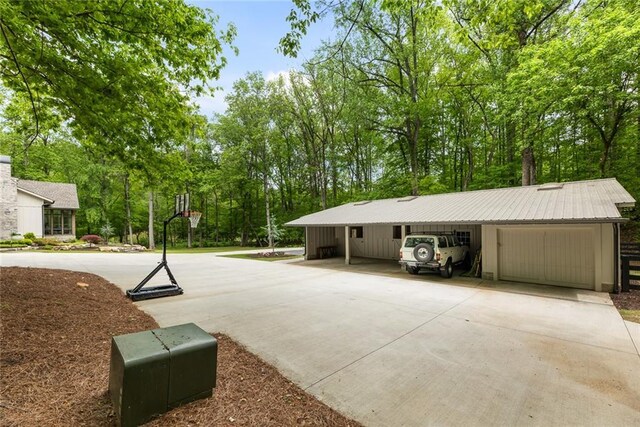exterior space featuring concrete driveway