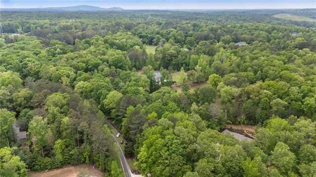 drone / aerial view with a view of trees