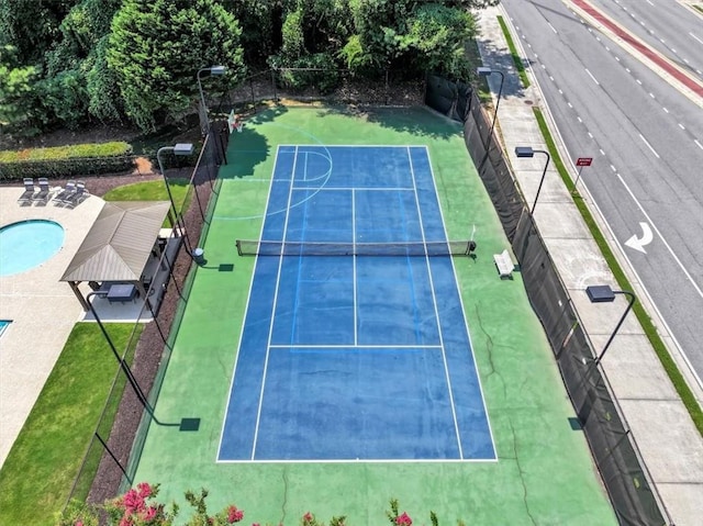 view of sport court featuring fence and community basketball court