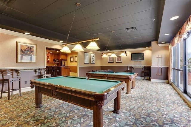 game room featuring billiards, visible vents, baseboards, ornamental molding, and carpet