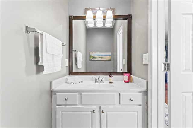 bathroom featuring a chandelier and vanity