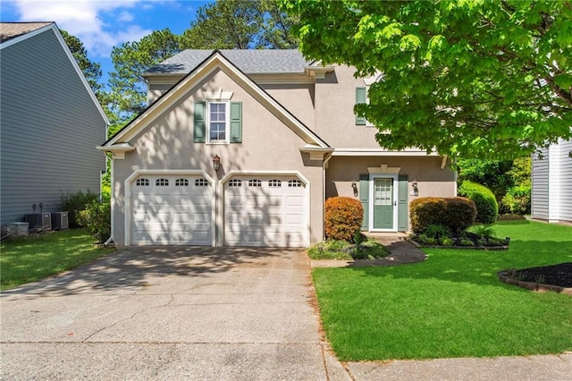 view of front of home with a garage, driveway, a front lawn, and stucco siding