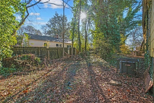 view of yard with central air condition unit