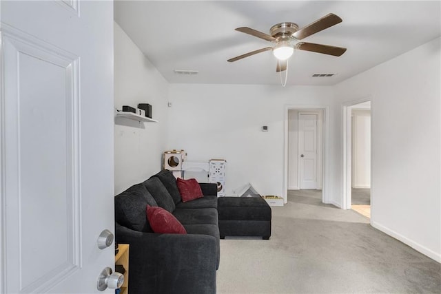 carpeted living room featuring ceiling fan