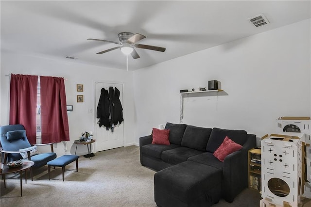 living room with ceiling fan and carpet flooring