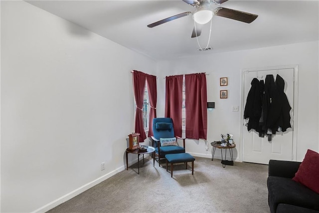 sitting room featuring ceiling fan and carpet flooring