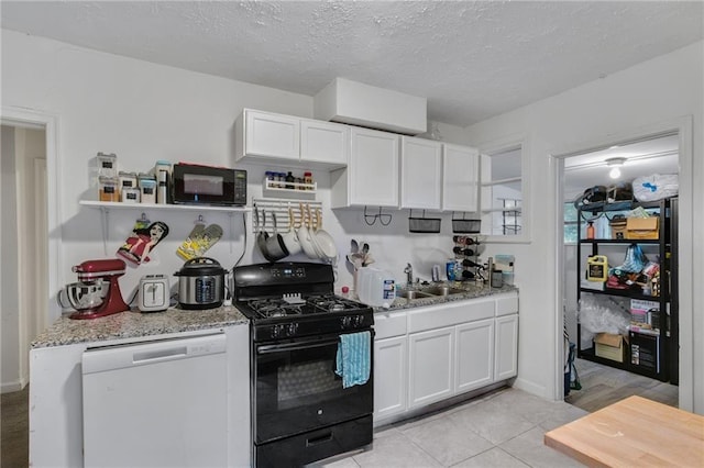 kitchen with white cabinetry, light stone countertops, sink, and black appliances