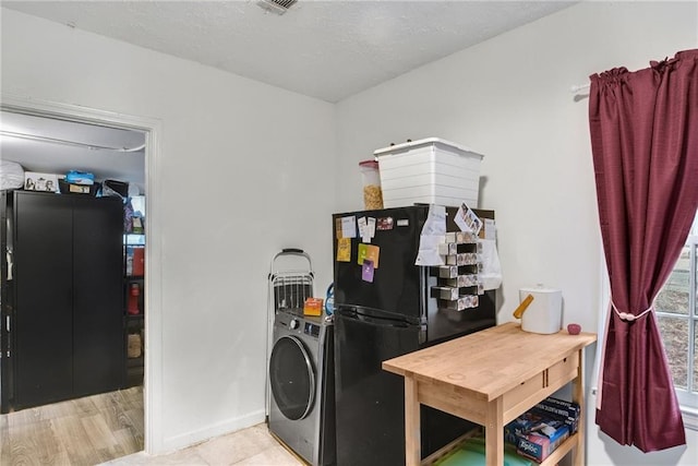 clothes washing area featuring washer / clothes dryer