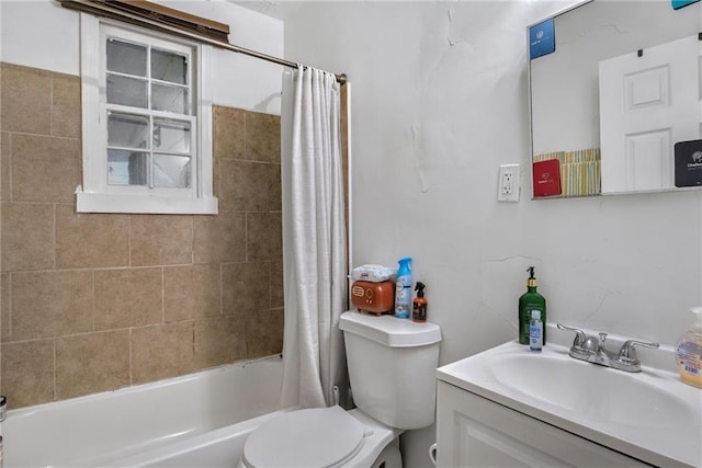 full bathroom with vanity, toilet, and shower / tub combo