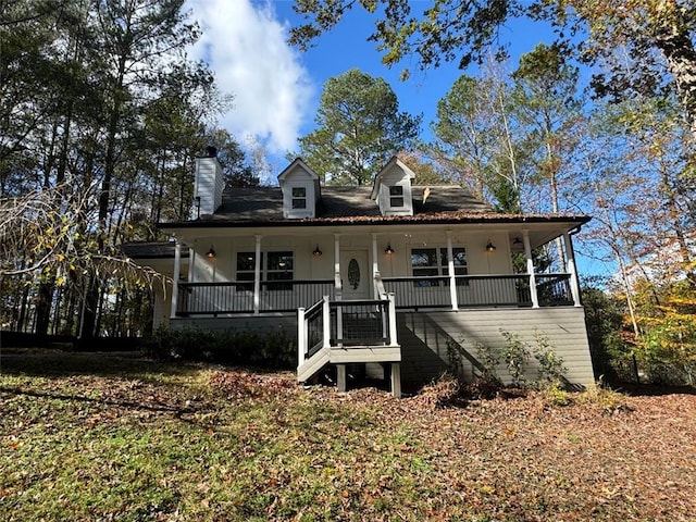 country-style home featuring covered porch