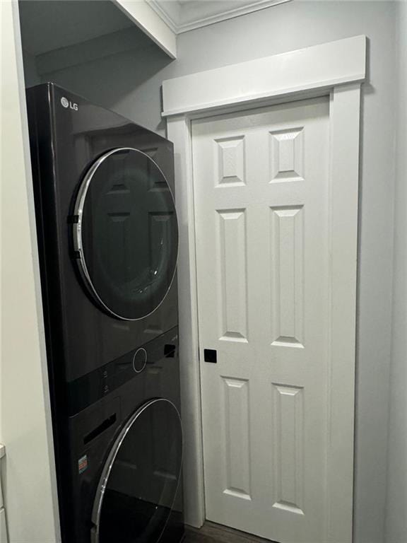 laundry area with stacked washer / dryer