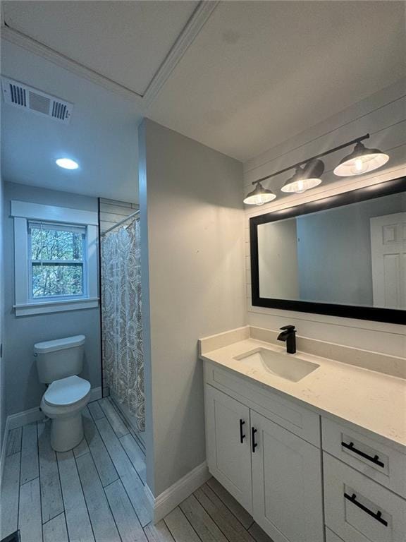 bathroom featuring vanity, curtained shower, toilet, and wood-type flooring