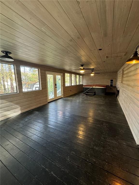 unfurnished sunroom with ceiling fan, lofted ceiling, and wood ceiling