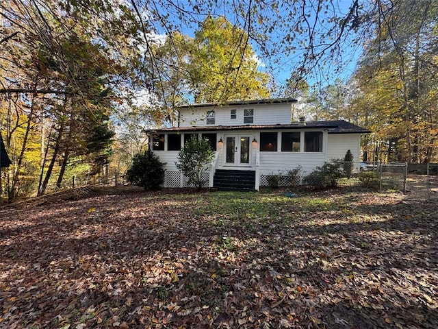 rear view of property with french doors