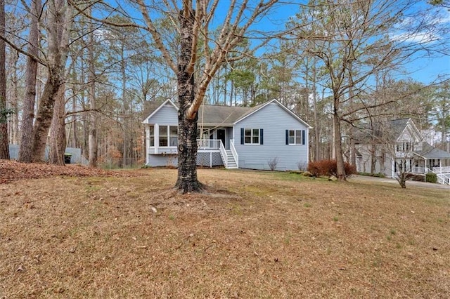 ranch-style home featuring a front yard