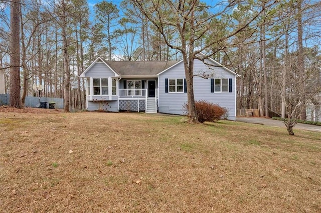 view of front facade featuring a front yard and a porch