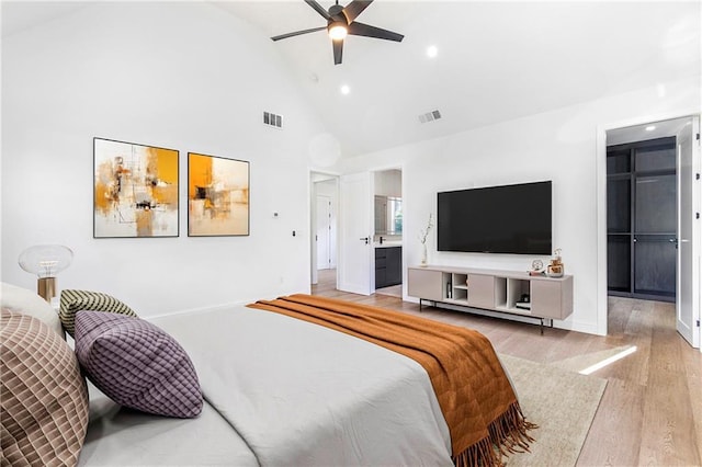 1247 Bridges Ave SW Unit A, Atlanta, GA 30310 - bedroom with high vaulted ceiling, light wood-style flooring, recessed lighting, a spacious closet, and connected bathroom