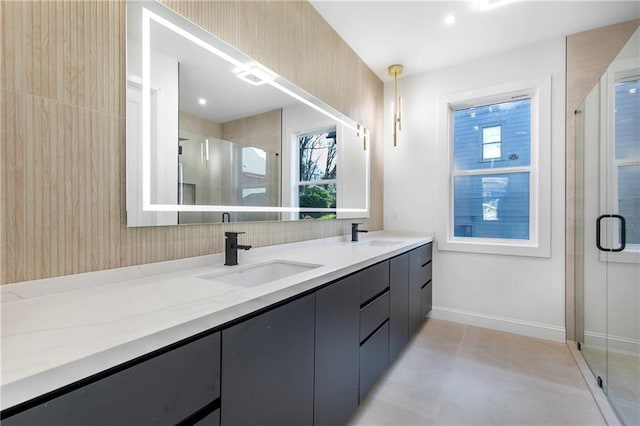 1247 Bridges Ave SW Unit A, Atlanta, GA 30310 - full bathroom featuring double vanity, a stall shower, healthy amount of natural light, and baseboards