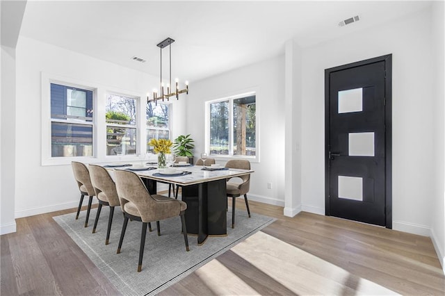 1247 Bridges Ave SW Unit A, Atlanta, GA 30310 - dining area featuring wood finished floors, baseboards, and a chandelier